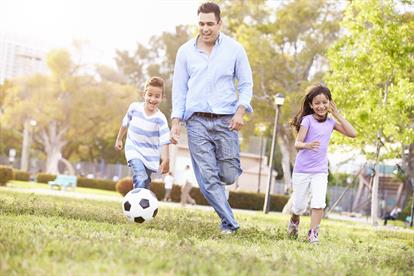 Gonzalez Family Playing Soccer in Park